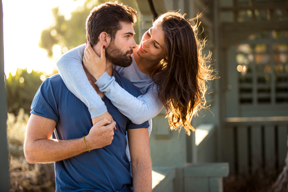 Scorpio man and his girlfriend look into each others eyes in love infatuated