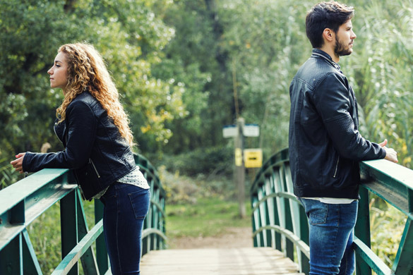 Portrait of young couple being in a conflict in the park - ways to get a scorpio man to commit to you