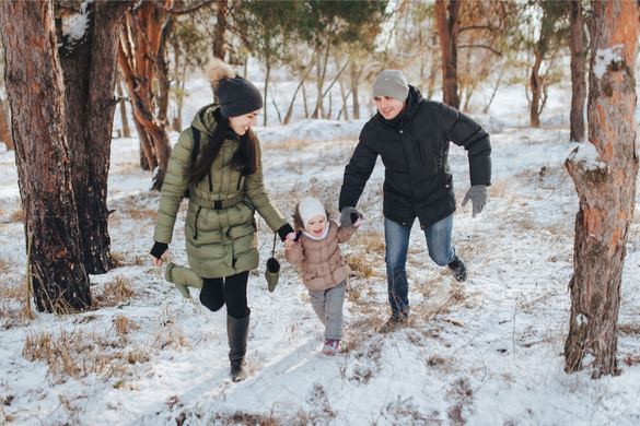 Mother and father having fun with their daughter